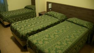 Letto o letti in una camera di Hotel Due Pini