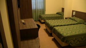 Letto o letti in una camera di Hotel Due Pini