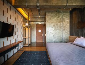 Postel nebo postele na pokoji v ubytování Navakitel Design Hotel