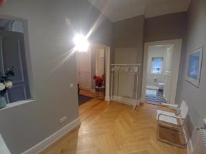 a room with a hallway with a light on the wall at Appartment Sonneck in Freiburg im Breisgau