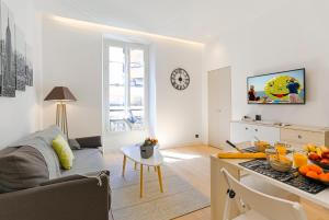 a living room with a couch and a table at MY CASA - 48 GIOFFREDO - NEAR PLACE MASSENA in Nice