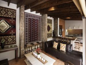 a living room filled with furniture and decor at Mont d'Or Bohemian House in Pretoria