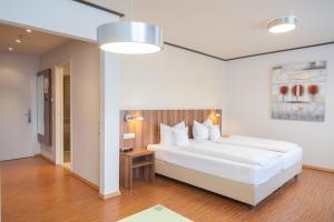 En eller flere senge i et værelse på Das Ebertor - Hotel & Hostel