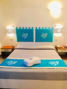 Кровать или кровати в номере Hotel Sandalion