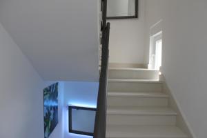 a staircase in a house with a window at Villa Marina in Omiš