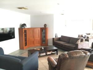 a living room with two couches and a tv at Fox Farm - Entire House Sleeps 12 ppl in Lenswood