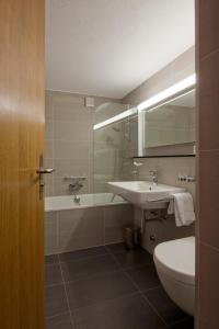 Vannituba majutusasutuses Hotel Allalin Saas-Fee