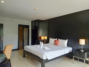 Postel nebo postele na pokoji v ubytování Amarin Samui Hotel - SHA Plus Certified