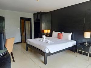 Postel nebo postele na pokoji v ubytování Amarin Samui Hotel - SHA Plus Certified