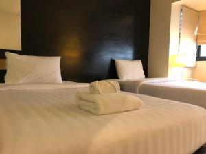 Postel nebo postele na pokoji v ubytování Amarin Samui Hotel - SHA Plus Certified