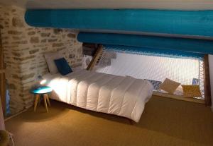 מיטה או מיטות בחדר ב-Le Mas Bellane