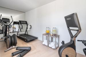 a gym with exercise equipment in a room at Vincci Selección Rumaykiyya in Sierra Nevada
