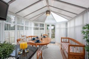 a dining room with a table and chairs at Rose Hill Retreat in Low Etherley