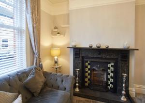 a living room with a couch and a fireplace at Host & Stay - Simba House in Saltburn-by-the-Sea