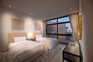 Postel nebo postele na pokoji v ubytování Dibba, Villa 61 - Mina Al Fajer, Dibba Al Fujairah