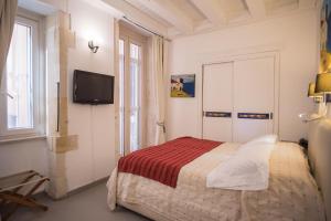 Ένα ή περισσότερα κρεβάτια σε δωμάτιο στο Aretusa Vacanze B&B