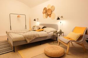 a bedroom with a bed with a hat on the wall at STUDIO ELA Centre in Košice