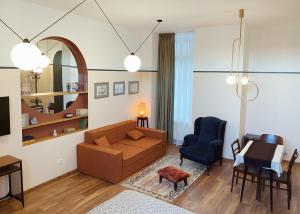 a living room with a couch and a table at CozyBaity in the very heart of Tbilisi in Tbilisi City