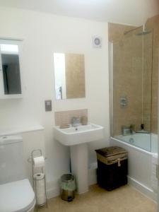 a bathroom with a sink and a toilet and a shower at Levada House in Cambridge