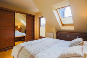 Posteľ alebo postele v izbe v ubytovaní Apartamenty Świnoujście - Rezydencja Sienkiewicza