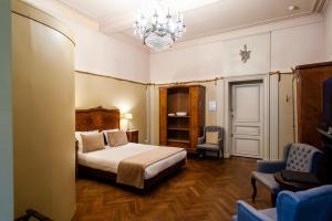 Ένα ή περισσότερα κρεβάτια σε δωμάτιο στο Charme Hotel Hancelot +39 φωτογραφίες