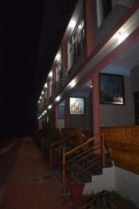 a row of pews in a church at night at Viraz Valley in Gokarna