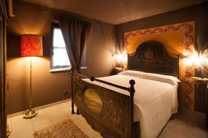 Postel nebo postele na pokoji v ubytování Hotel Il Campanile
