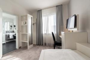 Cama ou camas em um quarto em Altstadthotel