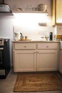 A kitchen or kitchenette at API Projects Athens - Parliament Apartment