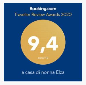 a sign that says travel review awards with a yellow circle at a casa di nonna Elza in La Spezia
