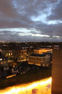 a view of a city at night with buildings at Stamford Bridge Hotel London in London