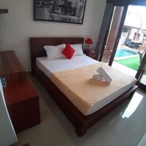a bedroom with a large bed with at D&D homestay in Pesanggaran