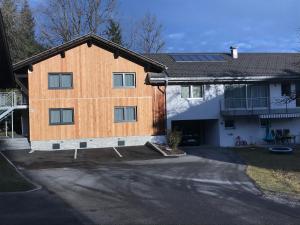 a house with solar panels on the side of it at Murmenta Appartements in Vandans