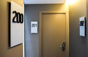 a door in a room with numbers on the wall at Hotel America Barcelona in Barcelona +86 photos