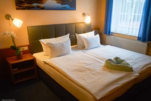 Voodi või voodid majutusasutuse Hotel Wutzler toas