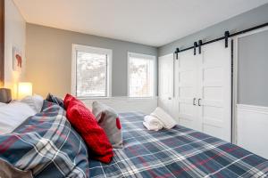 a bedroom with a bed with red pillows on it at Blue Mountain (1 bedroom) Escape at North Creek Resort in Blue Mountains +19 photos