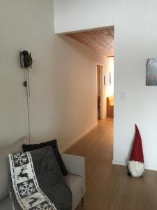 a living room with a santa hat sitting on a couch at I dr Rehwiesa C31 in Arosa