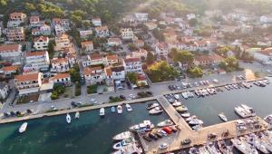 an aerial view of a harbor with boats in the water at Gina Bed & Breakfast in Tisno