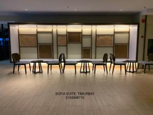 a group of tables and chairs in a room at Sofia Seaview Suite Timurbay Kuantan in Kuantan +31 photos