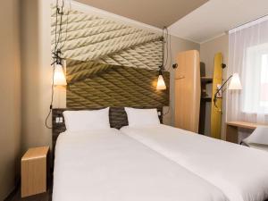Postel nebo postele na pokoji v ubytování ibis Vilnius Centre + 37 fotografií