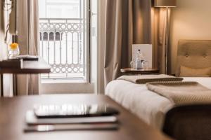 Postel nebo postele na pokoji v ubytování Corpo Santo Lisbon Historical Hotel
