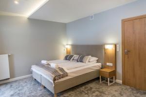Posteľ alebo postele v izbe v ubytovaní Royal Hill Residence