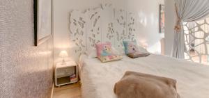 Ένα ή περισσότερα κρεβάτια σε δωμάτιο στο Un Appart En Ville "L'Alternative"