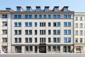 a large white building with many windows at Catalonia Berlin Mitte in Berlin