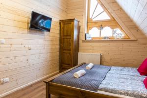 Posteľ alebo postele v izbe v ubytovaní udanypobyt Villa Sywarne Prestige