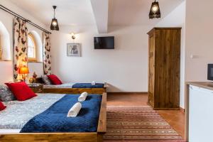 Posteľ alebo postele v izbe v ubytovaní udanypobyt Villa Sywarne Prestige