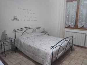 A bed or beds in a room at La Casa Dei Nonni