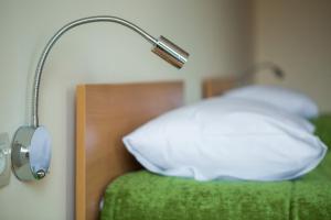 Postel nebo postele na pokoji v ubytování 7 Days City Hotel