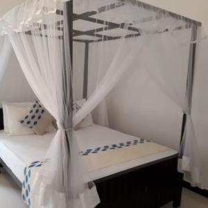 Postel nebo postele na pokoji v ubytování Apna Homestay Apartments