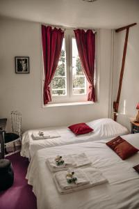 Säng eller sängar i ett rum på B&B Château De La Houssoye